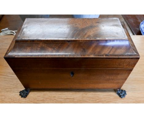 Regency mahogany sarcophagus tea caddy with rosewood crossbanding, brass lion mask and ring handles and claw feet, 35 cm wide