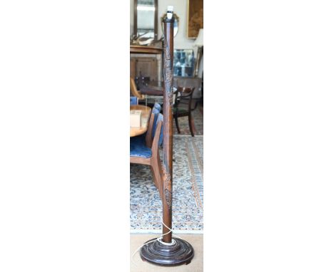 A Chinese hardwood standard lamp carved with river landscapes and figures, 167 cm high overall 