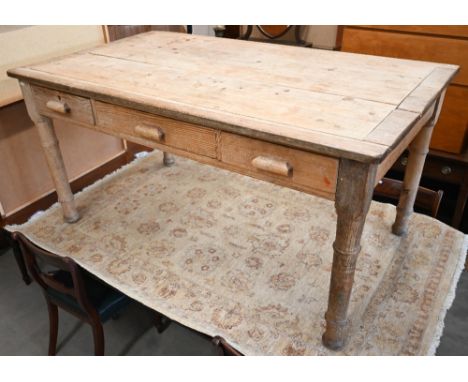 A pine and oak kitchen table with three drawers and gun barrel turned legs, 150 cm long x 89 cm wide x 76 cm high 