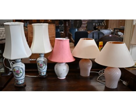 Two pairs of table lamps, a pair of floral Dresden style ceramics lamps, one plain pink spiral glass lamp and a single floral