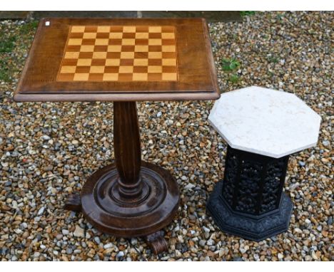 A cast iron Victorian style greenhouse heater body with veined marble travertine top, to/w a chess board top games table (2) 