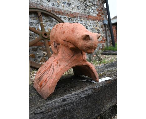 A small cast terracotta cat ridge tile 