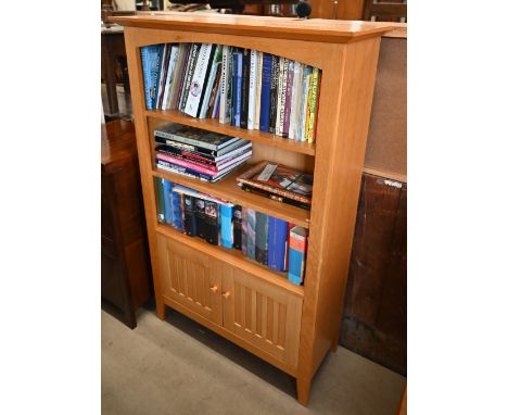 A light oak bookcase with cupboard doors, 140 cm high x 89 cm wide x 36 cm deep, original retail price £440, to match previou
