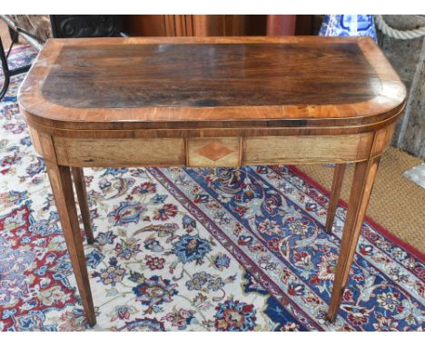 A 19th century rosewood and satin banded card table with folding scarlet felt lined top raised on square tapering legs, 91 cm