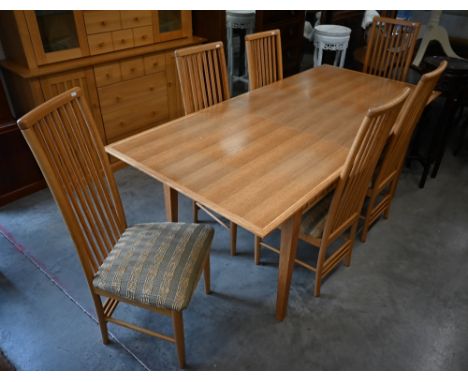 A modern light oak dining table with extra leaf, 200 cm long x 92 cm wide x 74 cm high to/w six stick back dining chairs and 