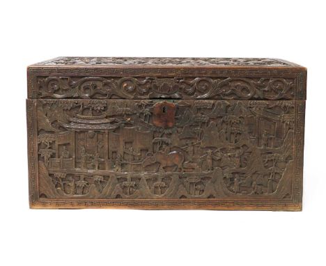 A Chinese sandalwood box,19th century, the hinged cover carved with Daoist immortals along with attendants in a rocky landsca