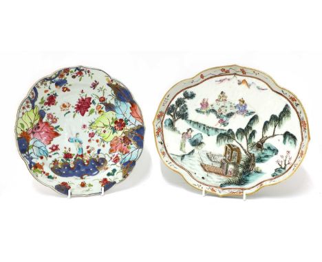 A Chinese famille rose tray, 19th century, of lobed quatrefoil form, painted with fishermen having a feast on a rock by a riv