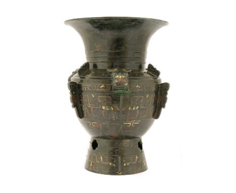 A Chinese bronze vessel, Ming dynasty (1368-1644), the globular body of oval sections, standing on a tall pierced pedestal fo