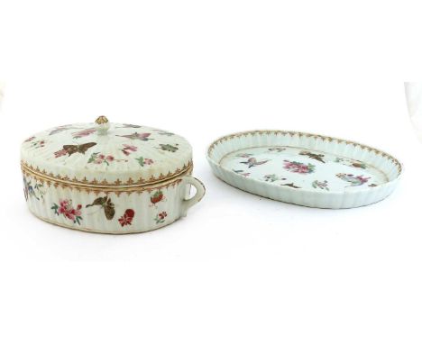 A Chinese famille rose tureen and cover, Guangxu (1875-1908), of lobed oval form, painted with butterflies and sprigs of flor