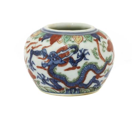 A Chinese wucai jarlet, of compressed globular form, painted with dragons chasing flaming pearls above waves, six-character W