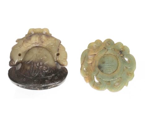 A Chinese jade carving, Republic period (1912-1949), of axe head form with a pair of addorsed dragons to the top, carved with