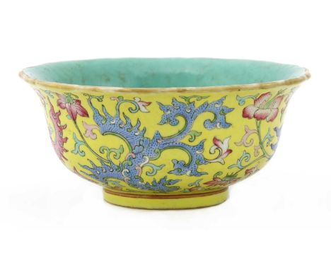A Chinese famille rose bowl,Qing dynasty (1644-1911), the rounded sides rising from a circular foot to a flared lobed rim, pa