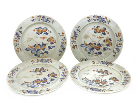 A collection of four Chinese export famille rose chargers, 18th century, painted with two birds perching on blossoming prunus