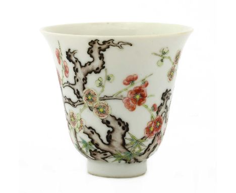 A Chinese famille rose cup,Qing dynasty (1644-1911), the bell-shaped body rising from a circular foot to a flared rim, painte