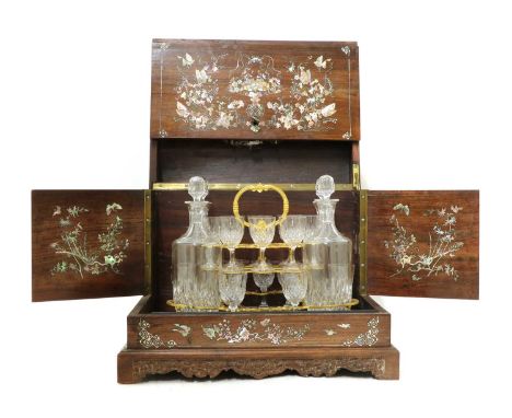 A Chinese export drinks cabinet,late 19th century, of box form, the rosewood meticulously inlaid in mother-of-pearl with a pr