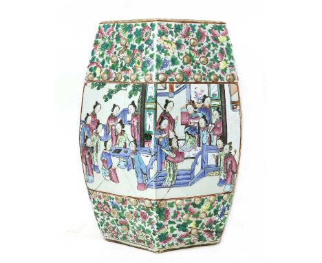 A Chinese famille rose garden seat, 19th century, of hexagonal form with pierced cash-shaped panels, painted with figures in 