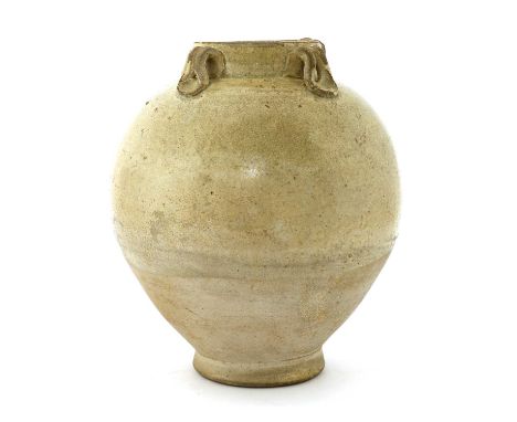 A Chinese Xing ware white-glazed jar,Tang dynasty (618-907), of ovoid form on a flared circular foot, with four lug handles t