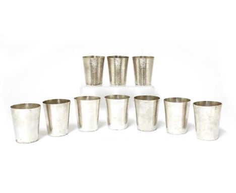 A set of ten Chinese export silver vodka cups,early 20th century, of tapering form with a spot-hammered ground, stamp marked 