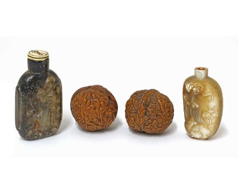 A pair of Chinese walnut carvings, with numerous monks, approximately 4cm long, a soapstone snuff bottle, carved with preciou