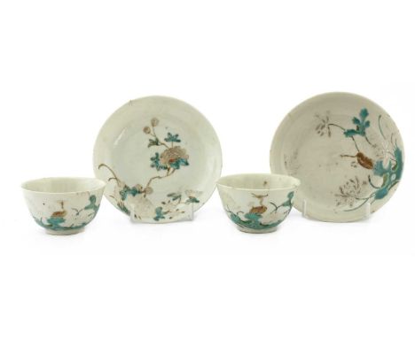 A pair of Chinese famille rose teacups, Guangxu (1875-1908), each cup with rounded sides rising from a circular foot, painted