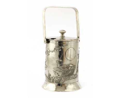 A Chinese export silver preserve jar and cover,early 20th century, of cylindrical form on a flared foot, decorated in relief 