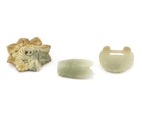 Three Chinese jade carvings, comprising: a plaque, Ming dynasty (1368-1644), in the shape of a flower with ruyi-shaped petals