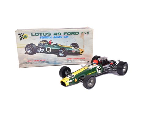 Tinplate Toys - a vintage Japanese made tinplate battery operated model of a Lotus 49 Ford F-1 racing car. VG+ condition, wor