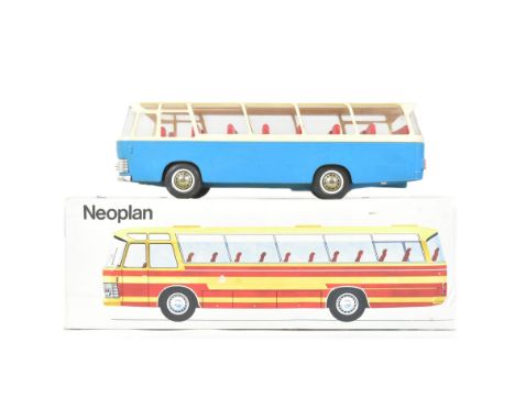 An original vintage Rex (West German) made friction motor single deck Neoplan model bus. Blue with cream roof and red interio