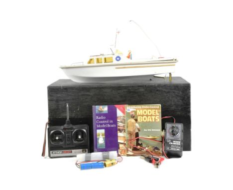 Model Boat - a scratch built hand made model RC Radio Control model boat / motor cruiser. Wooden construction with a plastic 