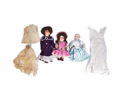 A collection of x3 small German Armand Marseille made bisque headed dolls. Two with brown flirty eyes and x1 with fixed light