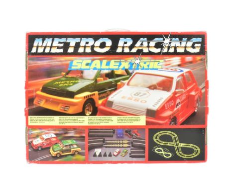 Scalextric - a vintage Hornby Micro Racing Scalextric slot car racing set. The set containing x2 rally cars, x2 controllers, 