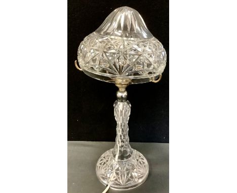 A cut glass mushroom lamp, shaped shade, faceted column, circular foot, 42.5cm high 