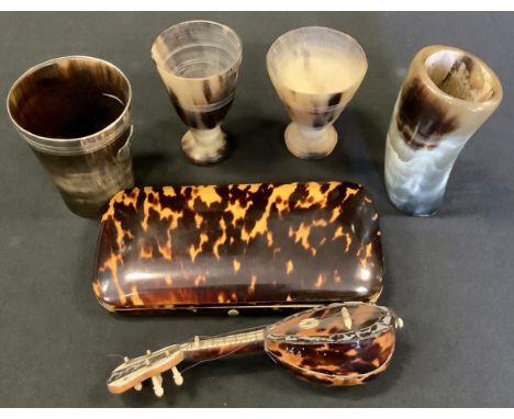 A 19th century tortoiseshell rounded rectangular cigar case;  miniature mandolin;  horn beakers;  Swan head handled carved wa