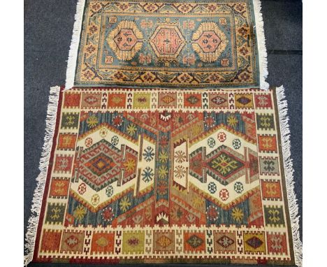 A hand-knotted Turkish Kilim rug, 172cm x 131cm;  another middle eastern carpet, (2) 