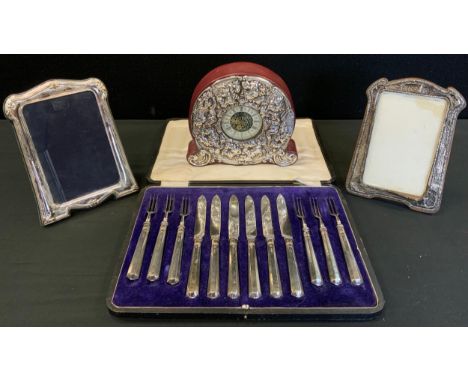 Silver mounted mantel clock, mechanical movement;  a silver photograph frame;  another;  Edwardian silver hafted fruit set , 
