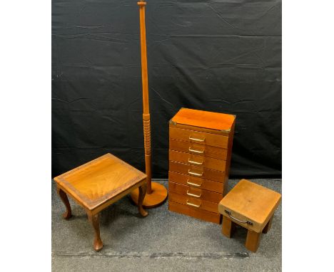 A narrow seven drawer pine chest, brass cornered top, 73.5cm high, 39.5cm wide, 28cm deep;  a carved square teak occasional t
