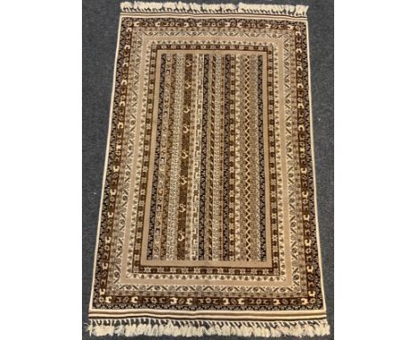 A fine hand-made Telle Turkaman rug / carpet, woven in muted tones of umber, brown, and cream, 190cm x 125cm. 