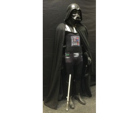 An Incerum full-size Darth Vadar Costume, with helmet, boots, control panel for voice;   etc;  a light sabre, signed by one t