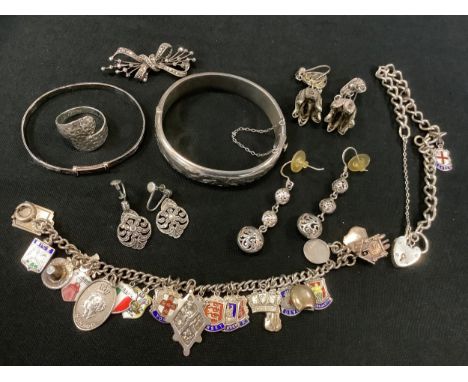 A silver Padlock bracelet;   silver charm bracelet;  silver hinged bangle;  another;  silver ring;  etc 