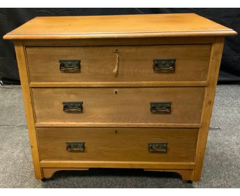A light oak three drawer chest over sailing top, art nouveau handles, 82cm high, 91.5cm wide, 48.5cm deep. 