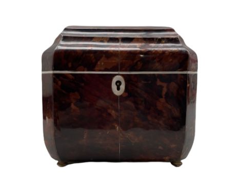 Faux tortoiseshell tea caddy of Regency style with stepped hinged cover, the interior with two covered compartments, mother o