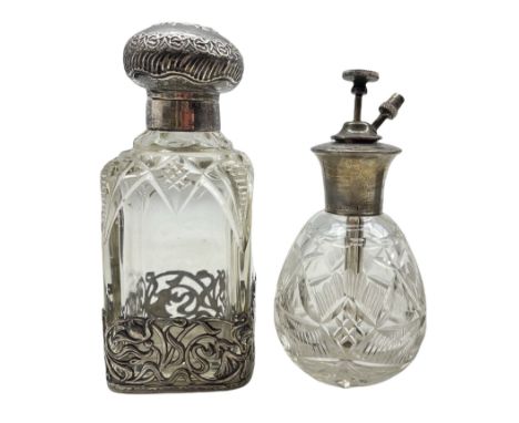 Edwardian silver and cut glass scent bottle with embossed cover and Art Nouveau style pierced silver base by William Hutton &