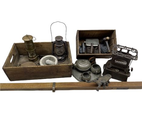 Wright &amp; Butler cast iron stove, various cast iron flat irons, Homeland hammered pewter four-piece tea set, brass miners 