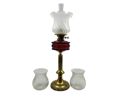 Victorian brass oil lamp with faceted ruby glass reservoir, reeded brass column and wrythen frosted glass shade, H71cm (inclu