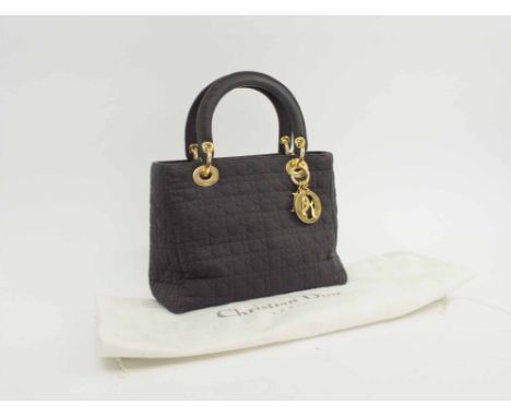 CHRISTIAN DIOR LADY DIOR, in quilt black fabric, gold tone hardware and Dior charmes, two top handles and top zip closure, br