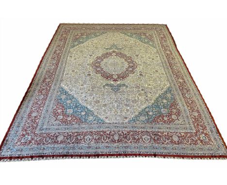 FINE PURE SILK HEREKE DESIGN CARPET, 350cm x 265cm, central medallion on an ivory palmette and vine field within correspondin