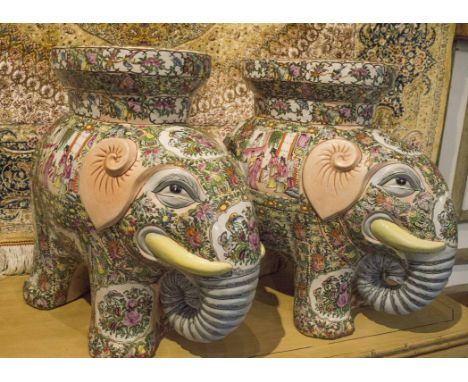 CHINESE PORCELAIN GARDEN SEATS, pair, modelled as elephants, decorated in Cantonese style with figures in a garden setting, a