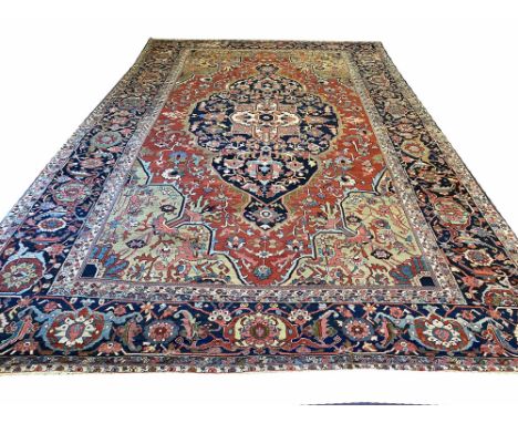 ANTIQUE SERAPI CARPET, 515cm x 330cm, central medallion on a terracotta field within corresponding spandrels and borders.