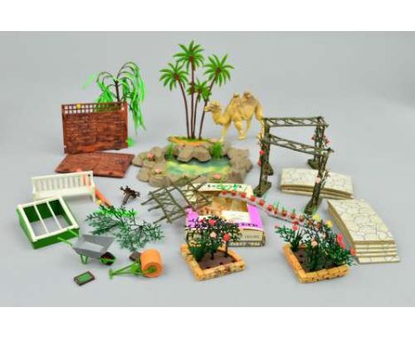A QUANTITY OF BOXED AND UNBOXED BRITAINS FLORAL MINIATURE GARDEN ITEMS, plants and accessories, includes boxed Brick Edging, 