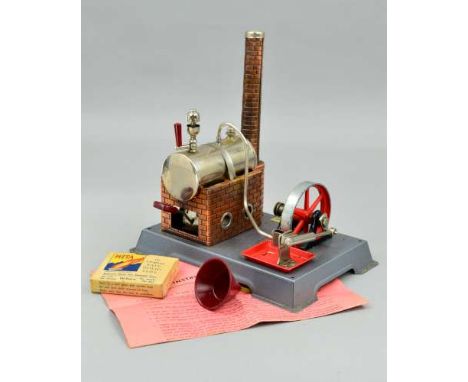 A LIVE STEAM ENGINE, possibly Wilesco D5, marked 'Made in Germany' to underside of tinplate base, Gammages label to top of ba